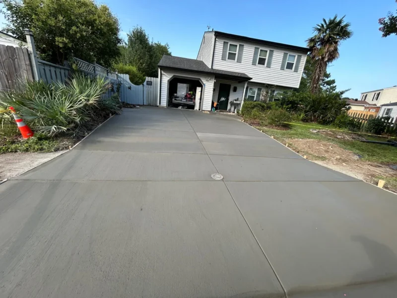 Concrete driveway with a finished surface and defined edges project