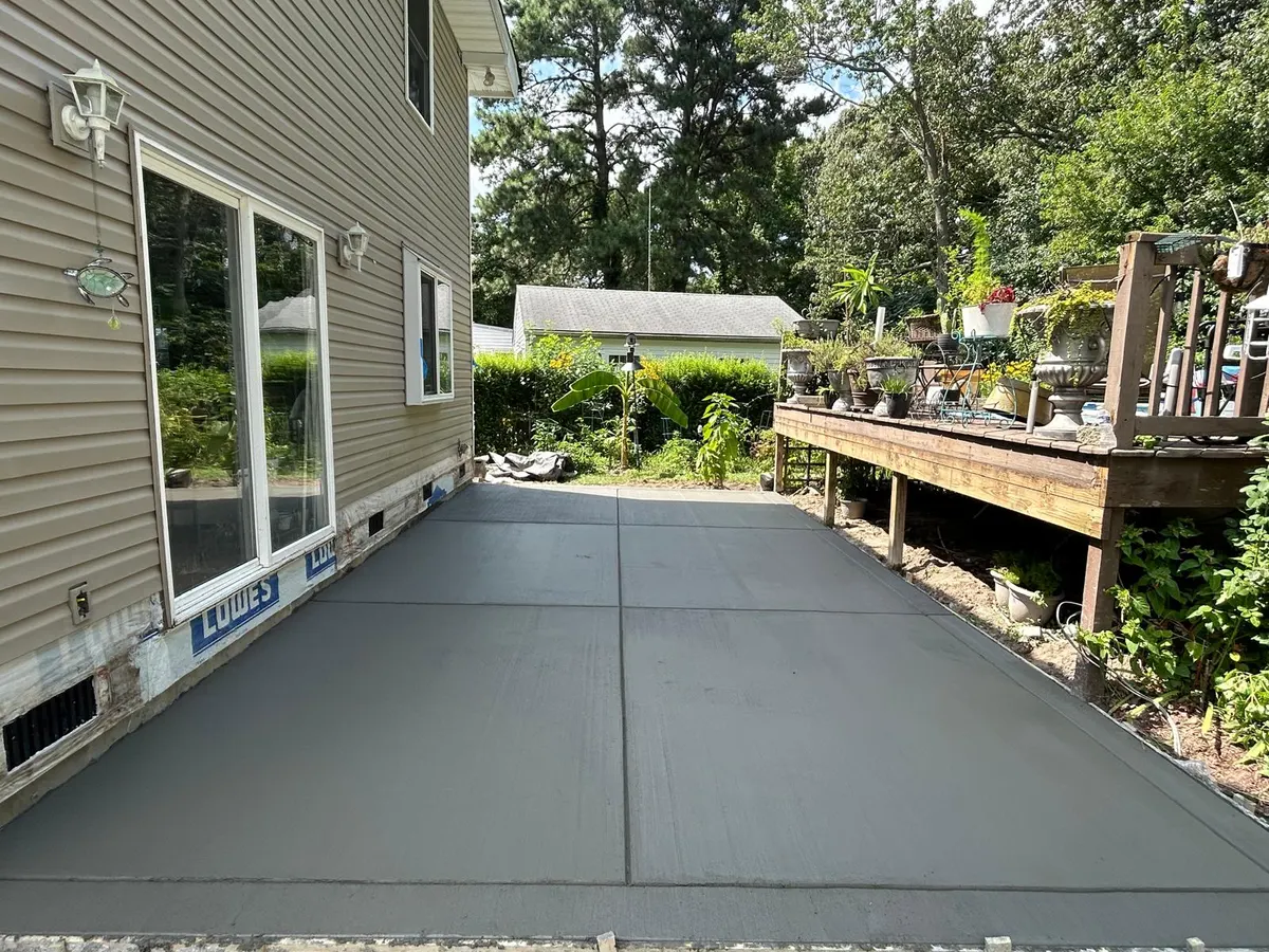 New concrete patio exterior home view 001