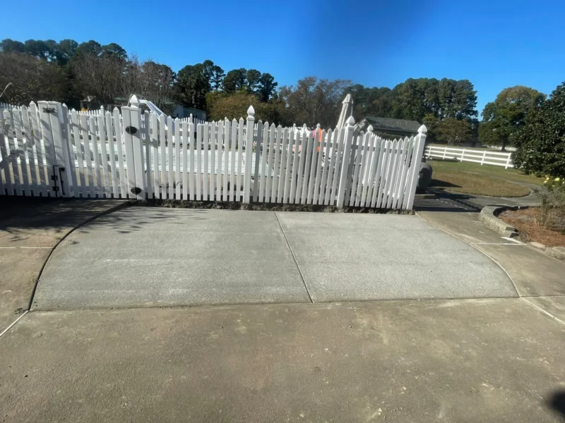 Concrete Walkway With White Picket Fence project